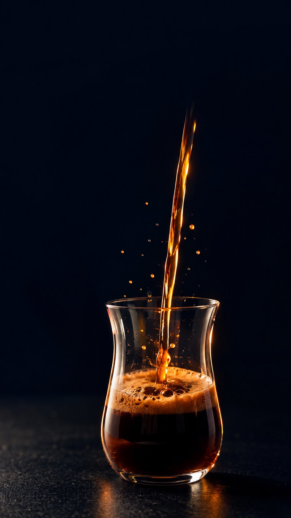 Amber coffee pouring into a glass